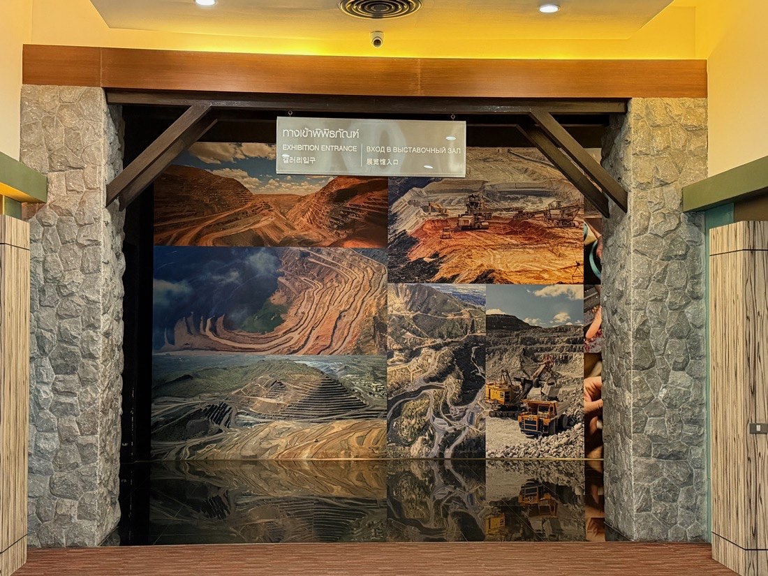 Timber exhibition doors printed with photographs of open-pit gem mines