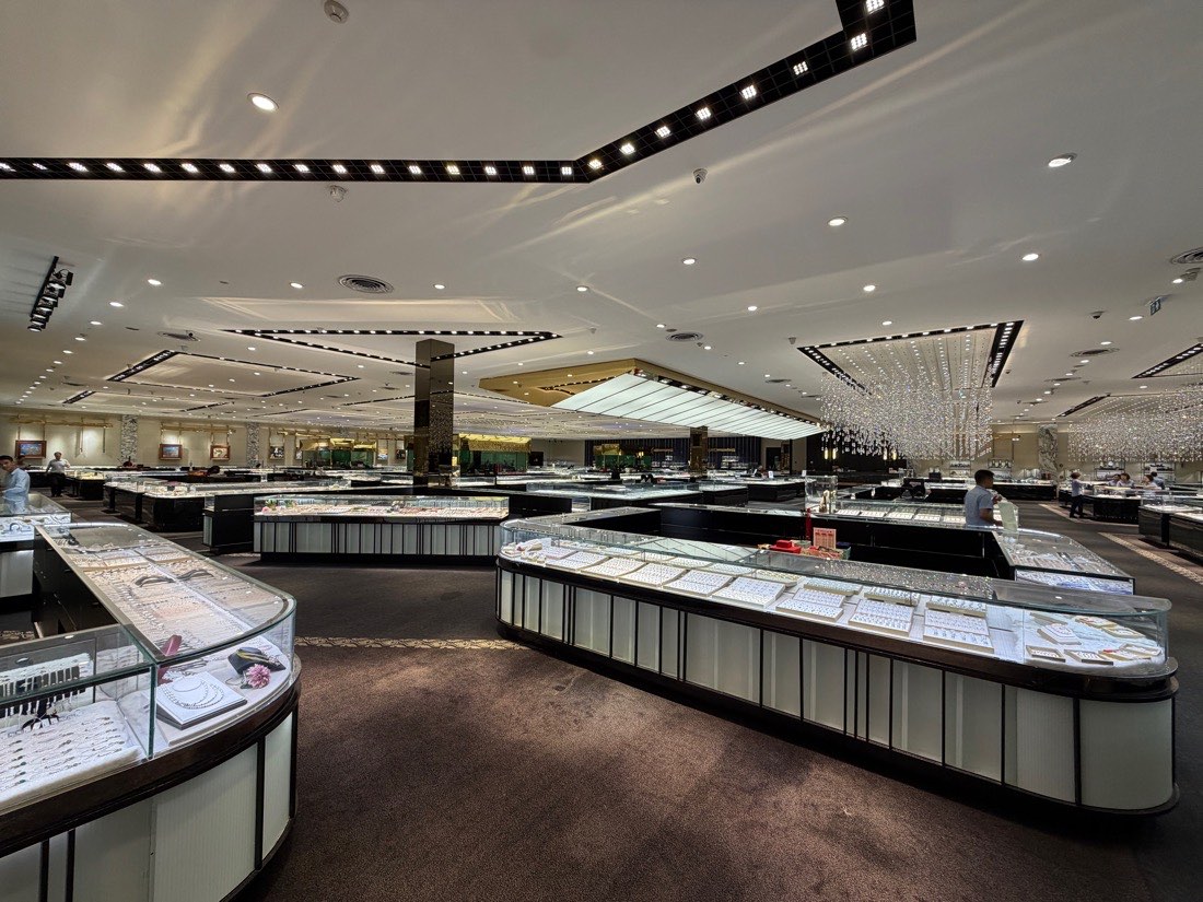 Jewellery counters stretching under chandeliers in the main showroom